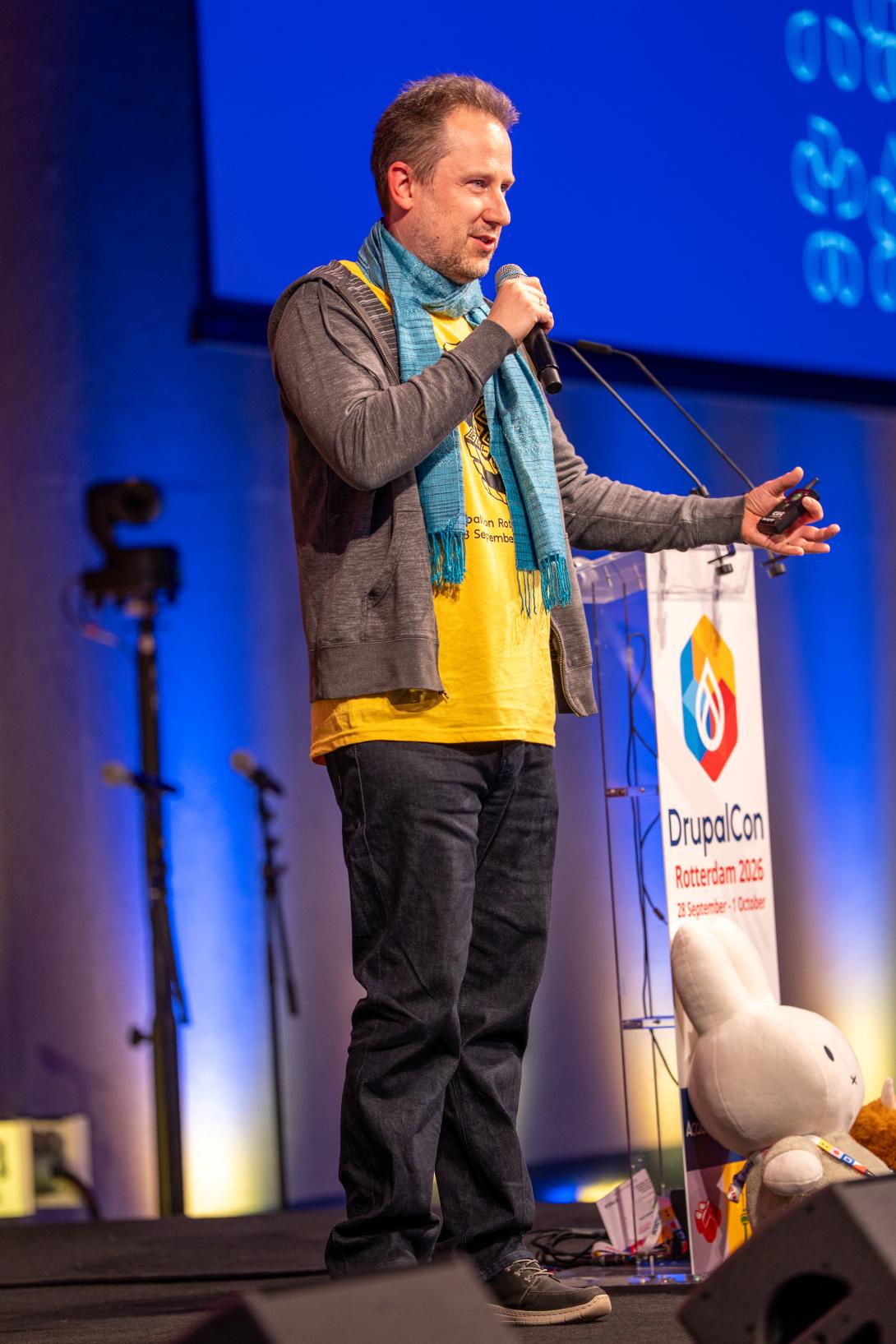 On stage at DrupalCon Rotterdam by Bram Driesen